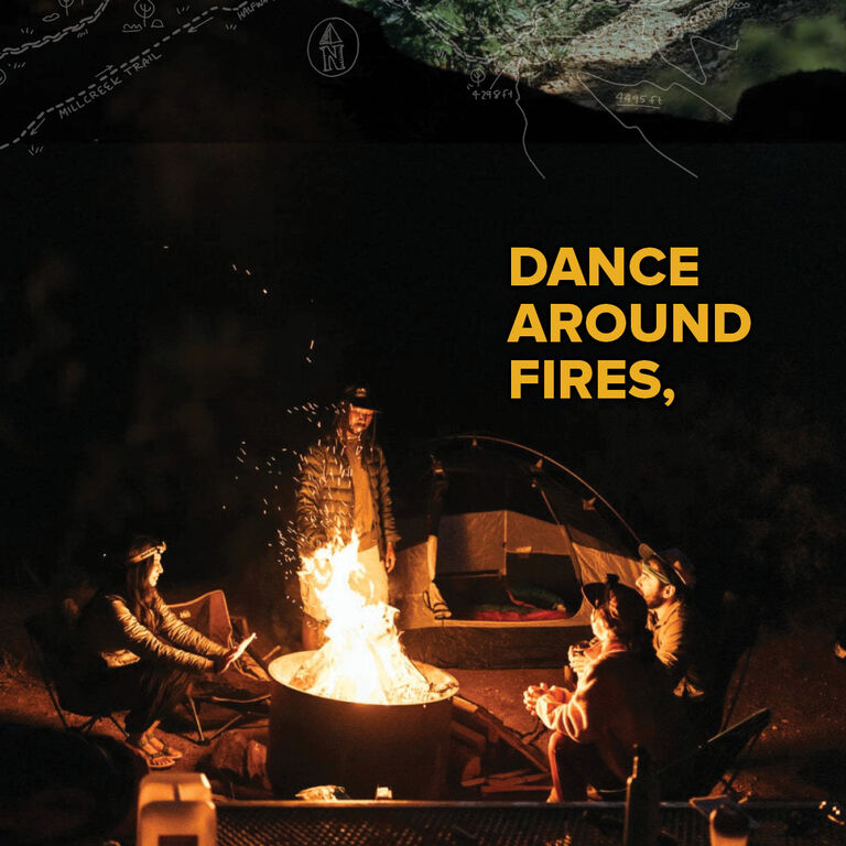 People wearing Teva sandals and shoes while camping, sitting around a fire