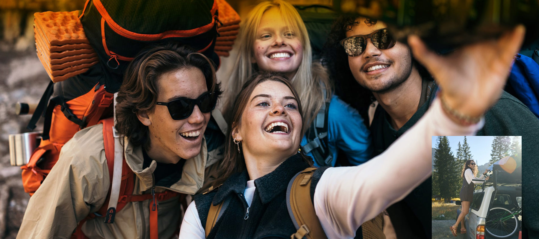 A group of young people that love outdoor activities like hiking, trekking, camping, adventuring taking a selfie.