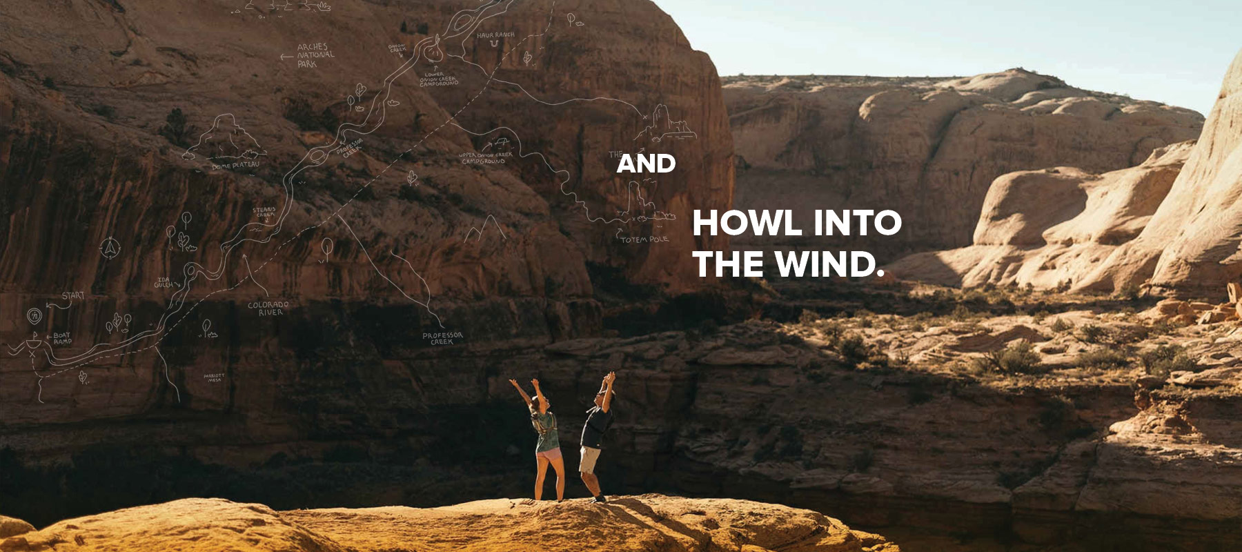 A man and a woman trekking through mountains wearing Teva hiking boots.
